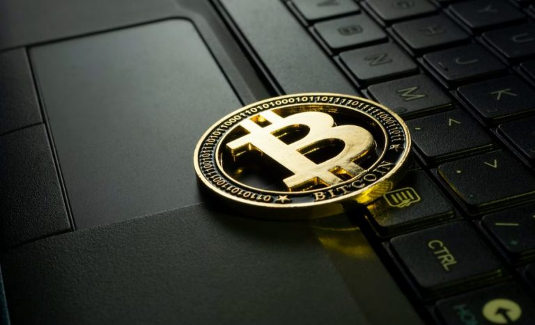 Bitcoin on Laptop Keyboard | How long does it take to buy bitcoin?