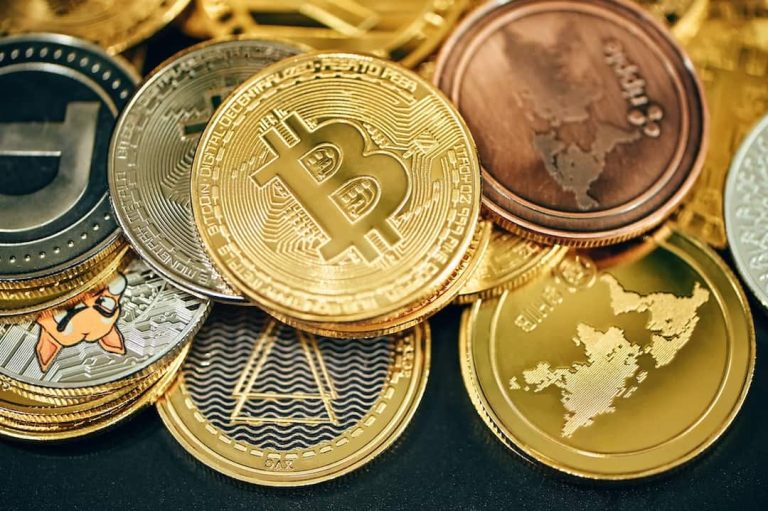 A stack of various crypto coins